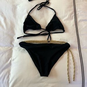 Black Bikini with golden belt hanging on the waist